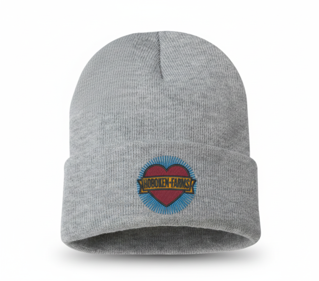 Gray beanie with a Hoboken Farms logo on a white background